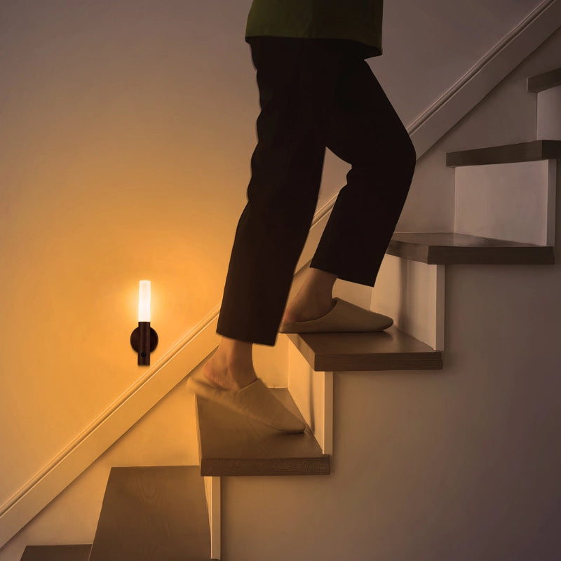 Rechargeable Lumi Motion Sensor Light mounted in a hallway, lighting up automatically at night.