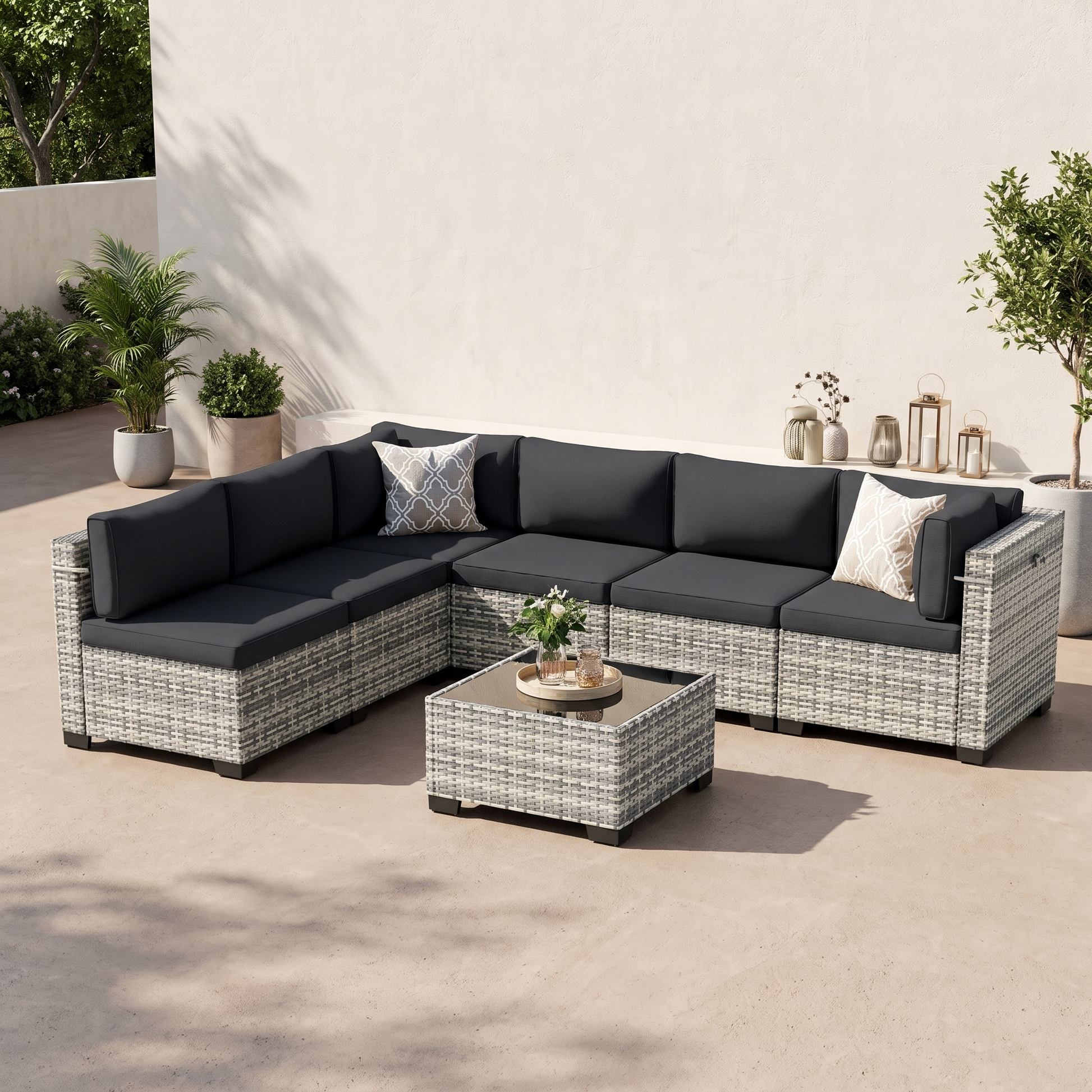Black-cushion 7-piece modular wicker outdoor sectional with tempered-glass coffee table on a neutral patio
