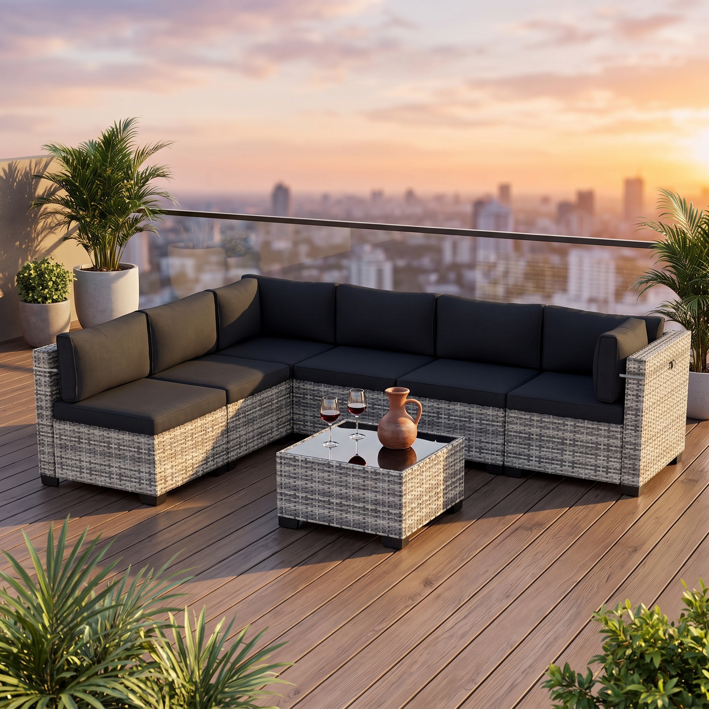 Black-cushion 7-piece wicker outdoor sectional on a rooftop terrace at sunset