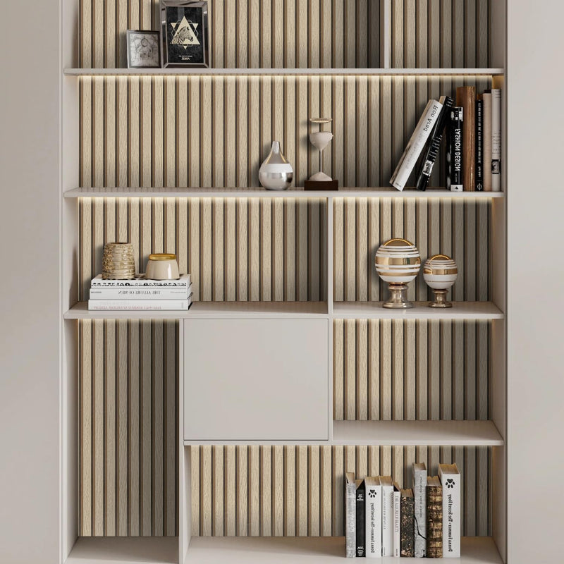 Modern bookshelf with wood panelling detailing styled with decor.