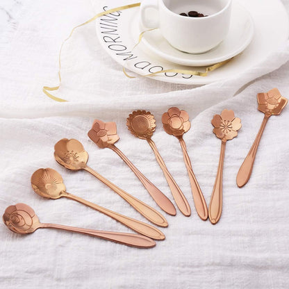 Rose gold flower spoons and a cup of coffee.