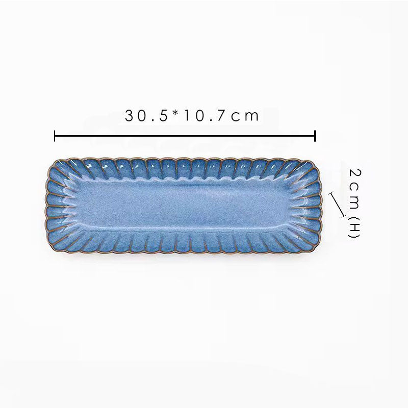 A blue rectangular ceramic plate with its dimensions labeled as 30.5 x 10.7 cm and 2 cm high.