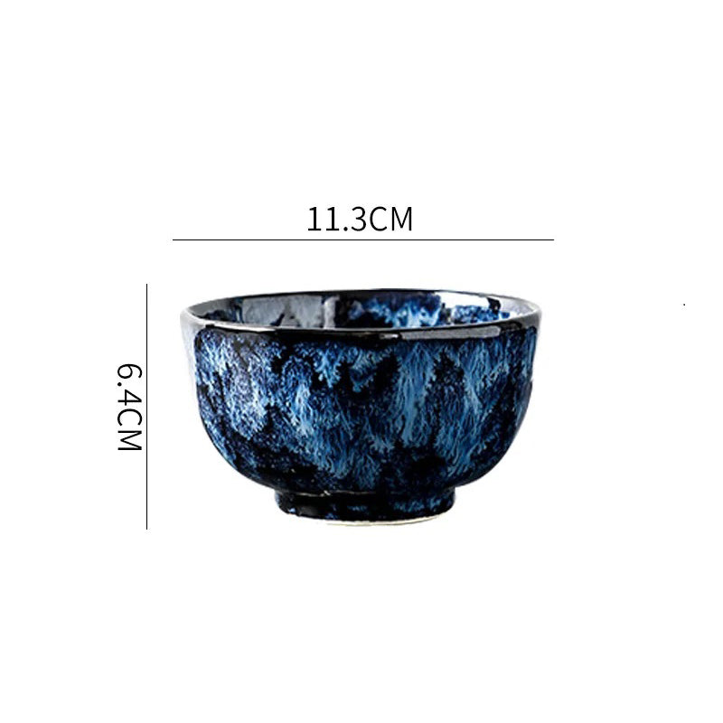 A deep, round ceramic bowl with a dark blue and white textured pattern, showing its dimensions: 11.3cm in diameter and 6.4cm in height.