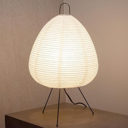 Close-up of the Akari lamp's rice paper shade, highlighting its soft, diffused light that creates a soothing atmosphere perfect for relaxation.