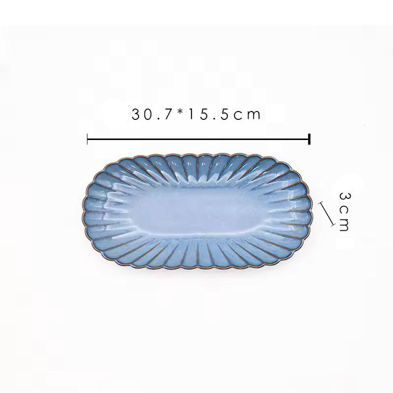 A blue oval ceramic plate with its dimensions labeled as 30.7 x 15.5 cm and 3 cm high.