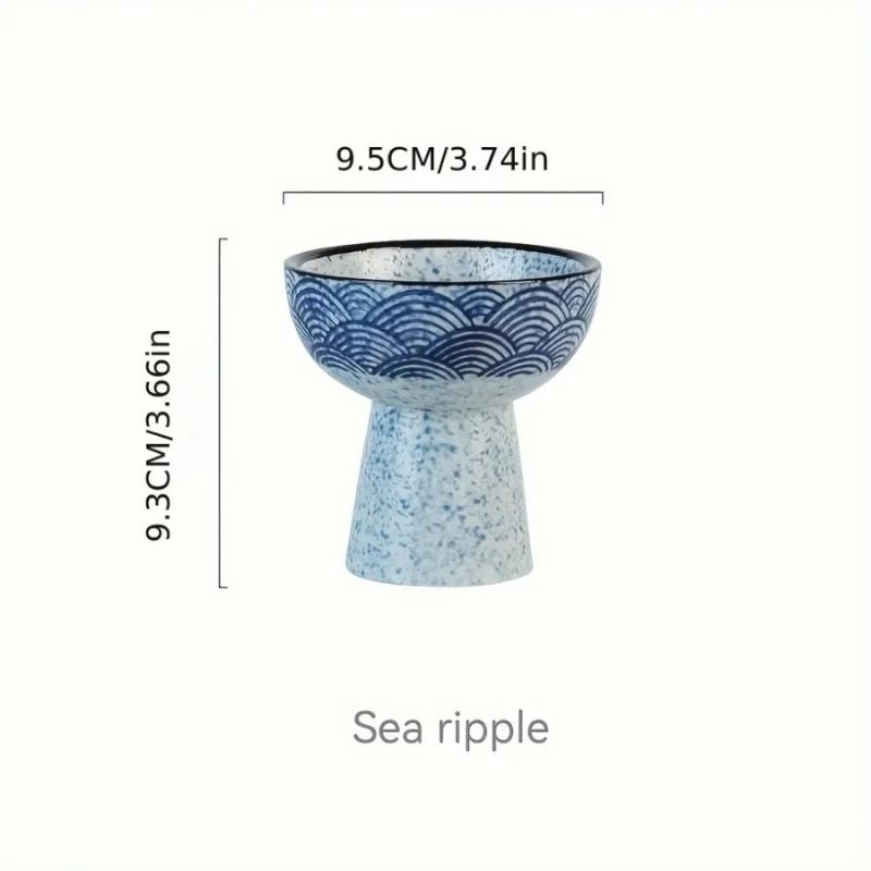 A ceramic ice cream bowl with a pedestal base, featuring a blue wave pattern on the upper half and a speckled white and blue lower half. The dimensions of the bowl are labeled as 9.5 cm (3.74 inches) in diameter and 9.3 cm (3.66 inches) in height. The design is named "Sea Ripple."