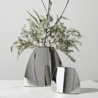 Arc Vase with a sleek metallic finish, holding a fresh floral arrangement, adding modern sophistication to any space.