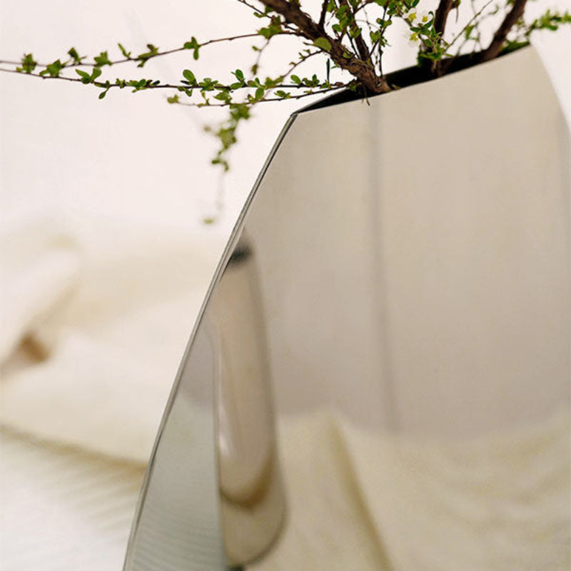 Sleek and modern Arc Vase, adding a touch of sophistication to any home decor or centerpiece.