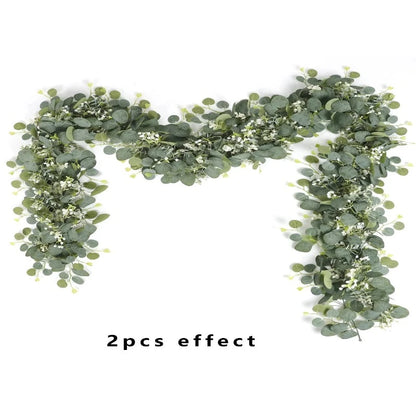 Two-piece set of artificial eucalyptus garlands, styled together to showcase their lush, lifelike leaves.