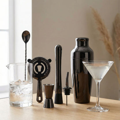 Black cocktail bar tool set featuring essential tools for home bartending.