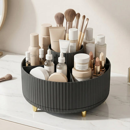 Black rotating vanity organizer holding cosmetic brushes and beauty products.