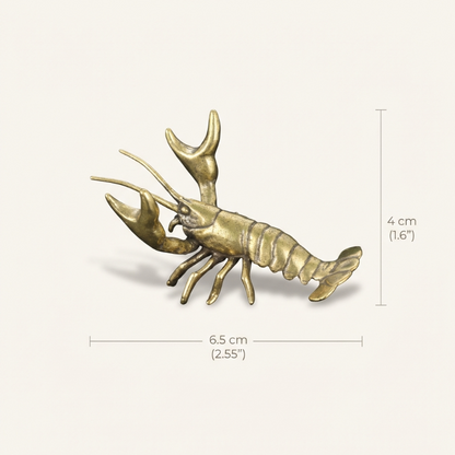 Brass lobster figurine with dimensions on a white background