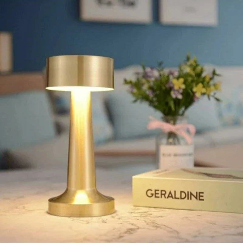 Compact cordless table lamp, offering flexible lighting solutions with a chic, contemporary design.