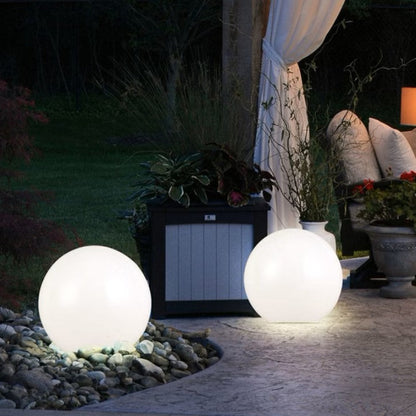 olorful garden ball lights glowing at night, perfect for outdoor decor.