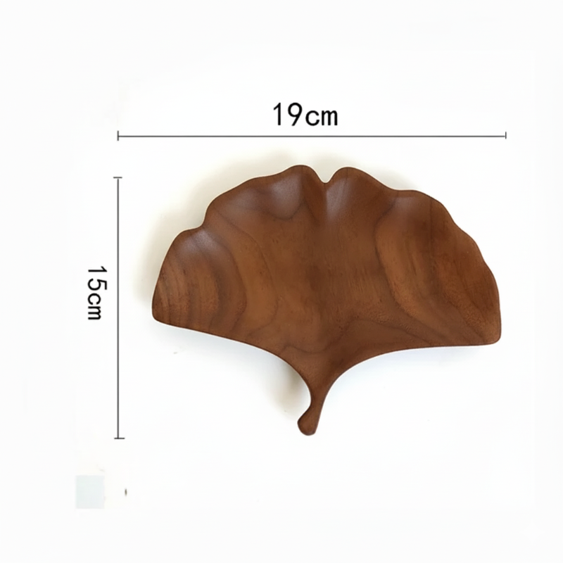 A dark brown wooden decorative tray or dish shaped like a fan-shaped ginkgo leaf, with dimensions marked as 15 CM in height and 19 CM in width, set against a plain white background.