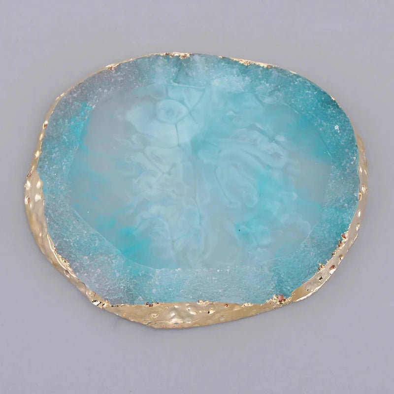 Close-up of a blue resin coaster with a polished surface, adding a cool, calming touch to your dining or coffee table.