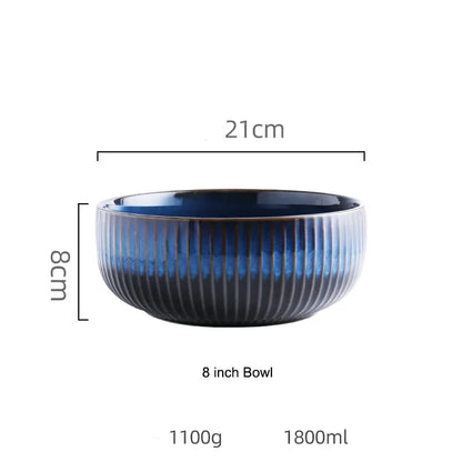 A blue ceramic bowl with a fluted texture is shown with its dimensions.