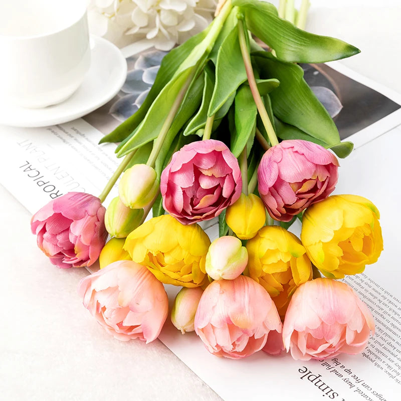 Parrot faux silicone tulips in assorted colors on white surface