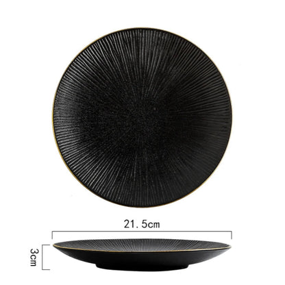 A top-down and side view of a black ceramic plate with a ridged texture and gold rim, showing its dimensions of 21.5cm in diameter and 3cm in height.
