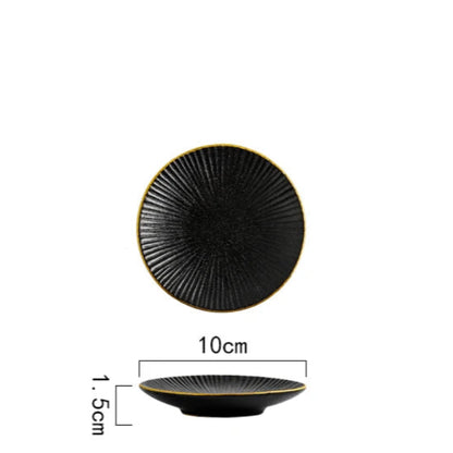 A top-down and side view of a small black ceramic plate with a ridged texture and gold rim, showing its dimensions of 10cm in diameter and 1.5cm in height.