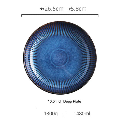 A round, blue ceramic deep plate with a fluted rim is shown with its dimensions.