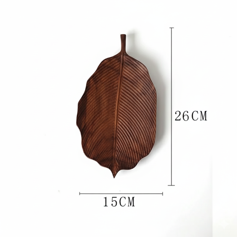 A brown, leaf-shaped wooden decorative tray or dish, with dimensions marked as 26 CM in height and 15 CM in width, set against a plain white background.