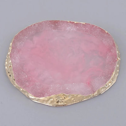 Close-up of a pink resin coaster with a smooth, glossy finish, perfect for adding a pop of color to any table or decor.