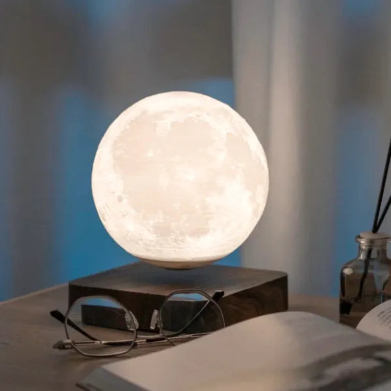 Realistic levitating moon lamp with 3D-printed lunar textures and soft lighting.