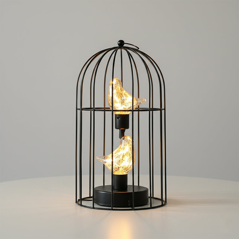 Decorative lamp with birdcage design and glowing bulbs on a neutral background