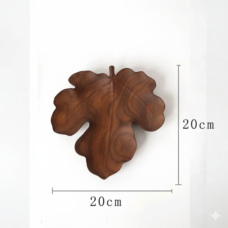 A dark brown, lobed, fig-leaf-shaped wooden decorative tray or dish, with dimensions marked as 20 CM in height and 20 CM in width, set against a plain white background.