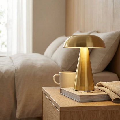 Close-up of metallic mushroom table lamp in gold