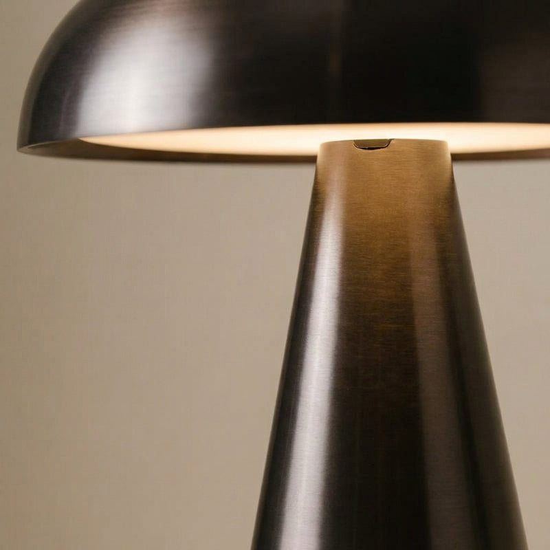 Close-up of metallic mushroom table lamp in black