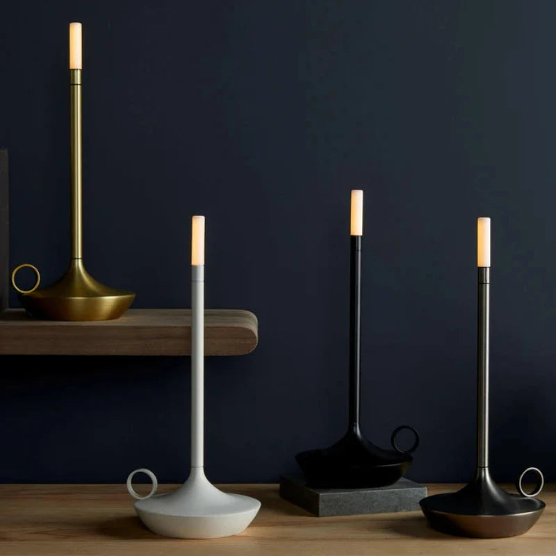 Portable candle lamp on a nightstand, creating a calming mood.