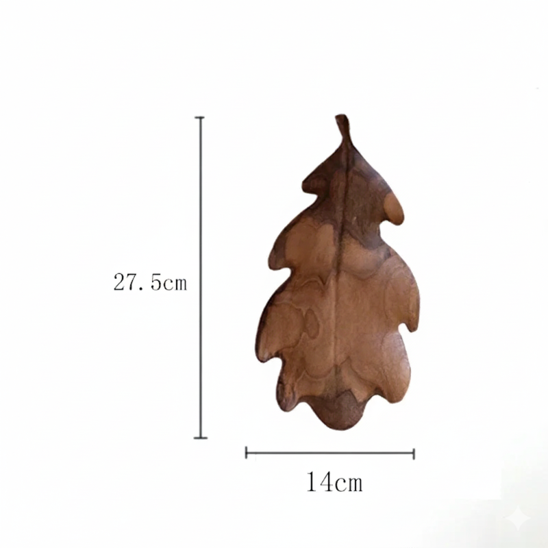 A dark brown wooden decorative tray or dish shaped like a lobed oak leaf, with dimensions marked as 27.5 CM in height and 14 CM in width, set against a plain white background.