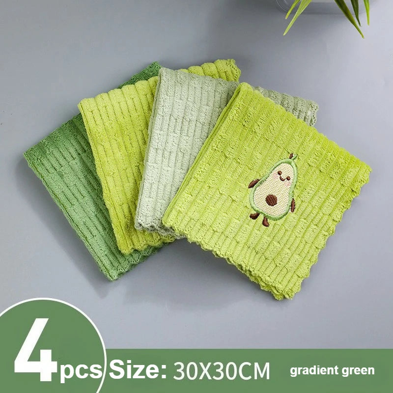 Four green textured dishcloths with a gradient effect on a gray background.