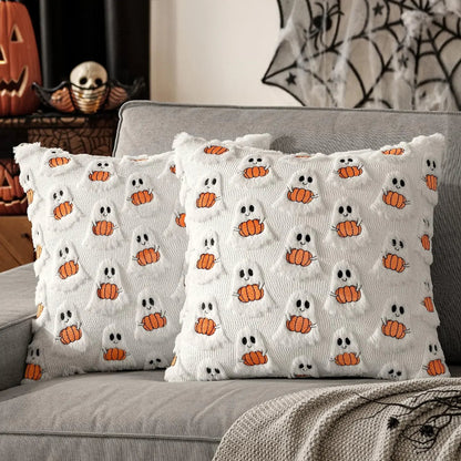 Halloween-themed decorative pillows with ghost and pumpkin patterns on a gray couch.