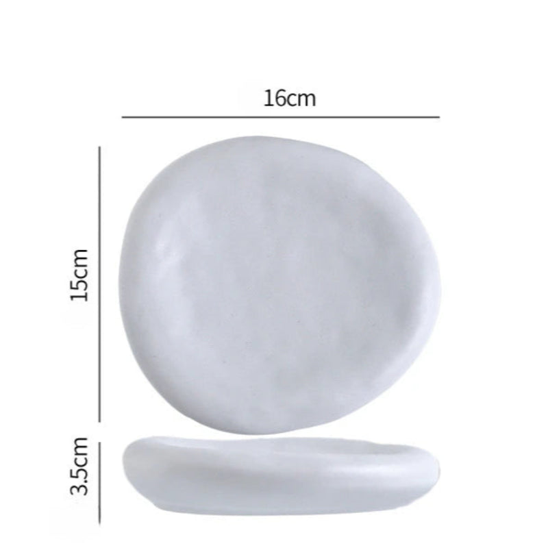 White oval plate with dimensions labeled on a white background