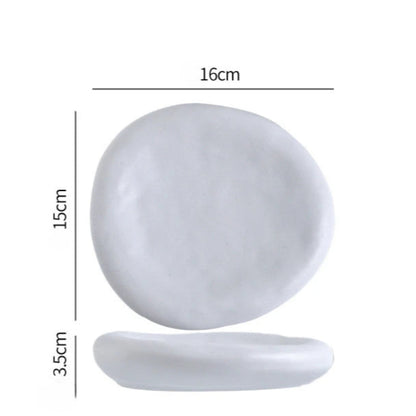 White oval plate with dimensions labeled on a white background