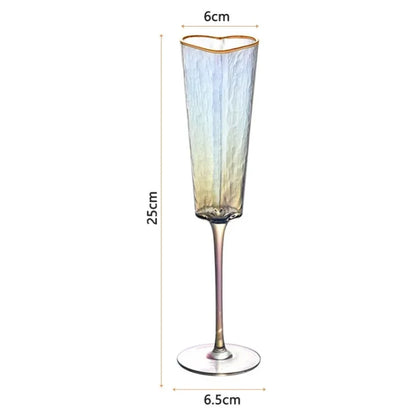 A single iridescent heart-shaped champagne flute with a gold rim, showing its dimensions: 25cm tall, 6cm wide at the top, and a 6.5cm base diameter.