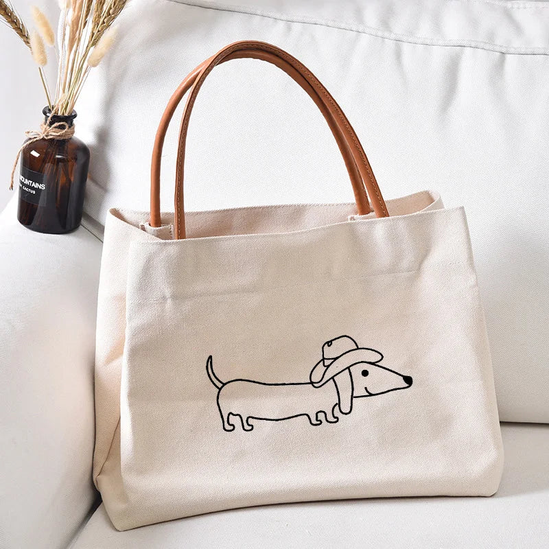 Canvas tote bag with a dachshund wearing a cowboy hat.