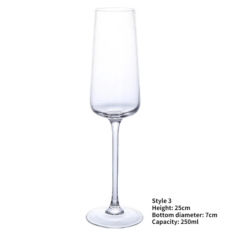 A single, empty champagne flute with a ribbed design on the bowl, a long stem, and a round base. The dimensions and capacity are listed in the bottom right corner.