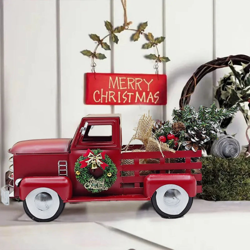 Decorative red Christmas truck with wreaths and a 'Merry Christmas' sign on a white background.