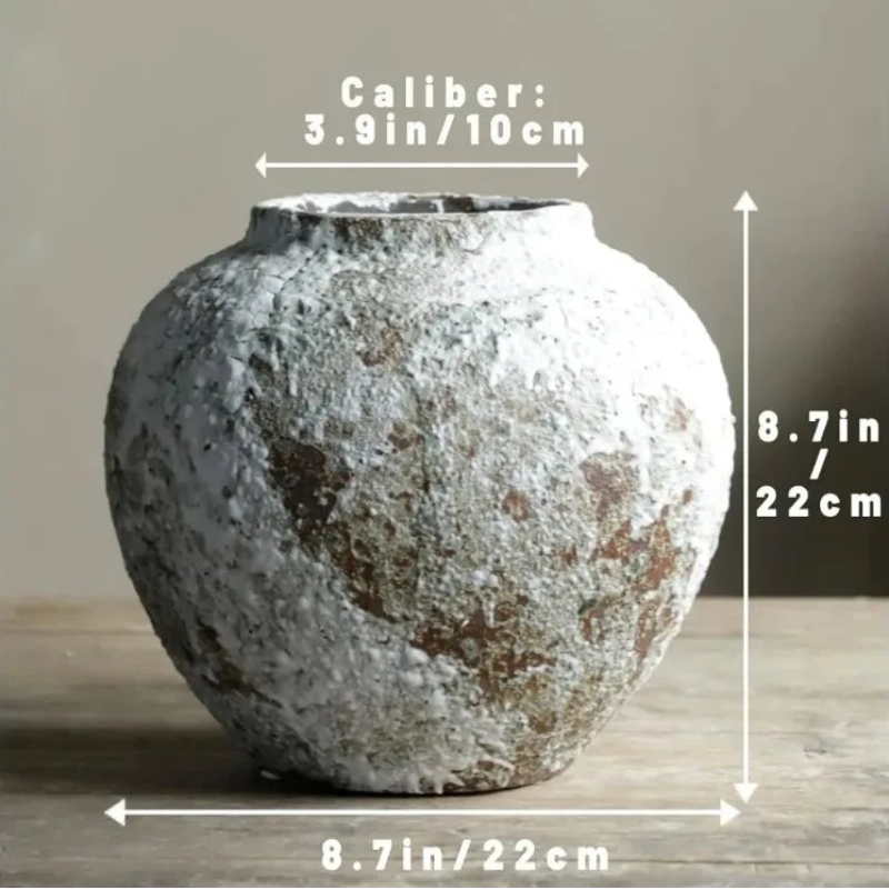 Vintage-style ceramic pot with measurements on a neutral background