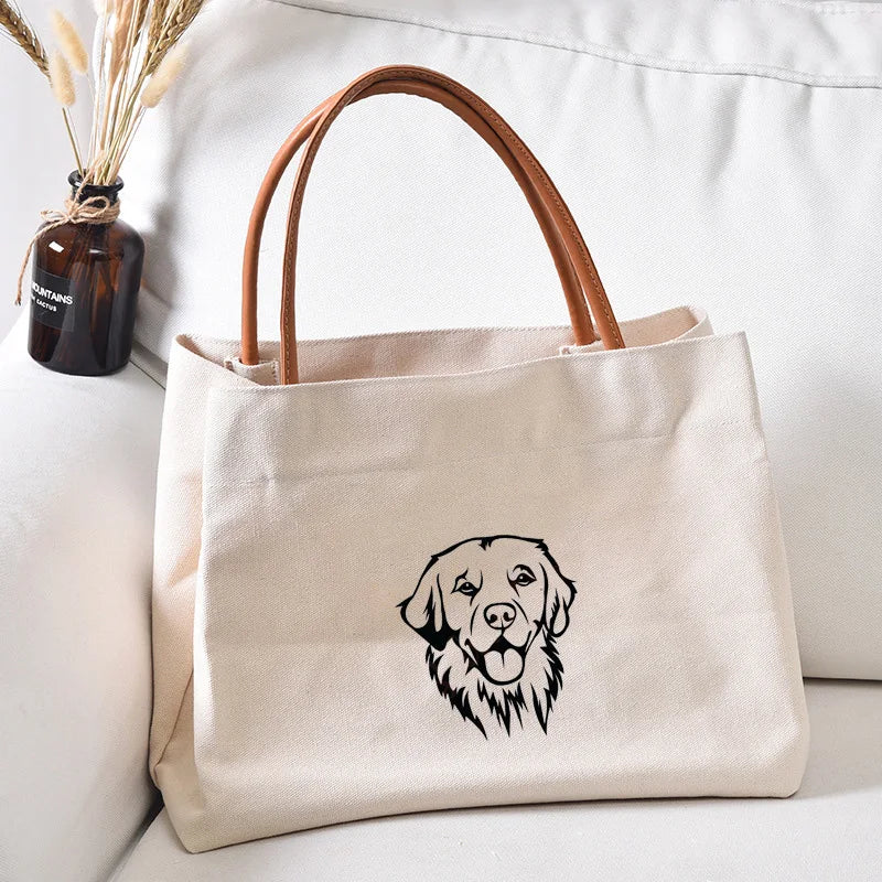 Canvas tote bag with a golden retriever graphic.
