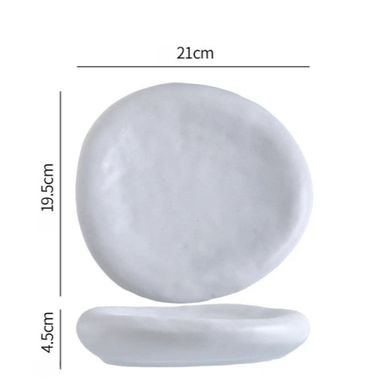 White ceramic plate with dimensions labeled on a white background