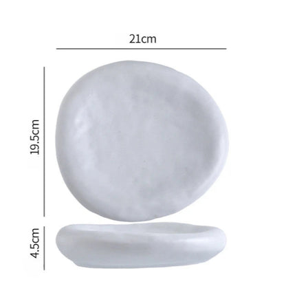 White ceramic plate with dimensions labeled on a white background