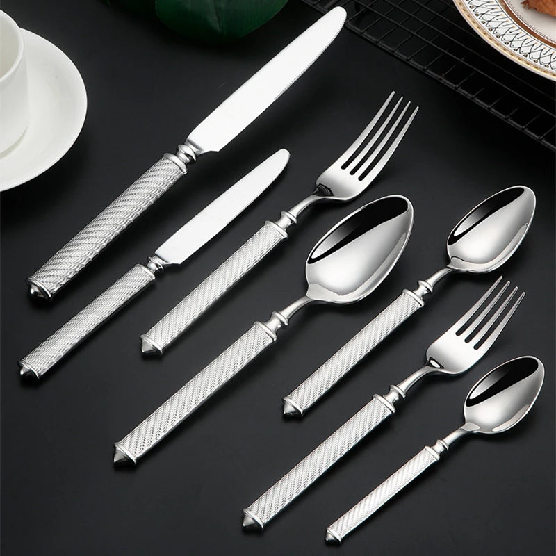 Silverware set on black surface