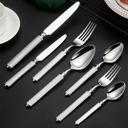 Silverware set on black surface