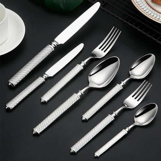 Silverware set on black surface