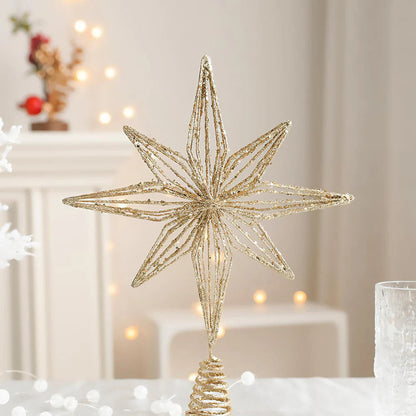 Gold glitter wire star Christmas tree topper.